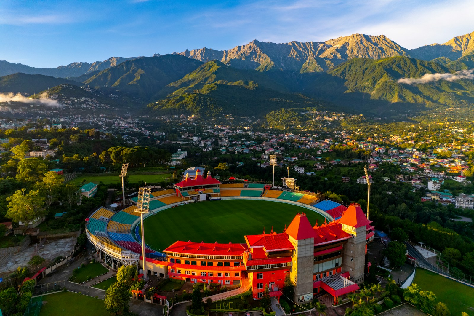 https://www.holidaypartner.in/wp-content/uploads/sites/1/2025/11/dharamshala-cricket-stadium.jpg